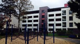 A housing block that also includes meeting space and a playground